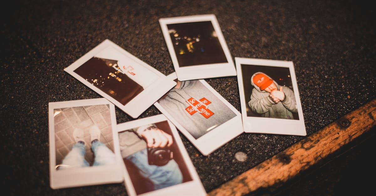 How many extra pellets are fired from a Two Shot Prefix Shotgun? - From above of instant photos placed on gray asphalt ground in evening time