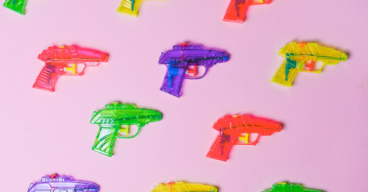 How many games did the Psycho Mantis know? - Top view of various multicolored toys for fight arranged on pink background as representation of game How many games did the Psycho Mantis know? - Top view of various multicolored toys for fight arranged on pink background as representation of game