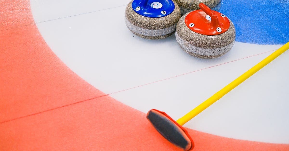 How many games did the Psycho Mantis know? - From above of heavy multicolored granite curling stones and long brush placed on ice with circular target area in arena How many games did the Psycho Mantis know? - From above of heavy multicolored granite curling stones and long brush placed on ice with circular target area in arena