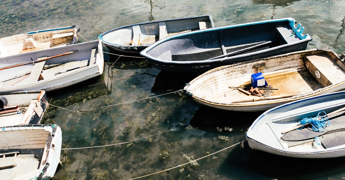 How many ions a day keep the rebels away? - From above of small simple empty boats moored to shore with long thin ropes in sunlight How many ions a day keep the rebels away? - From above of small simple empty boats moored to shore with long thin ropes in sunlight