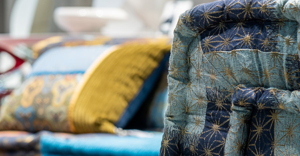 How many patterns can be stored in a pattern provider? - Colorful back of couch placed near bright sofas with vivid soft cushions in modern light furniture store on blurred background