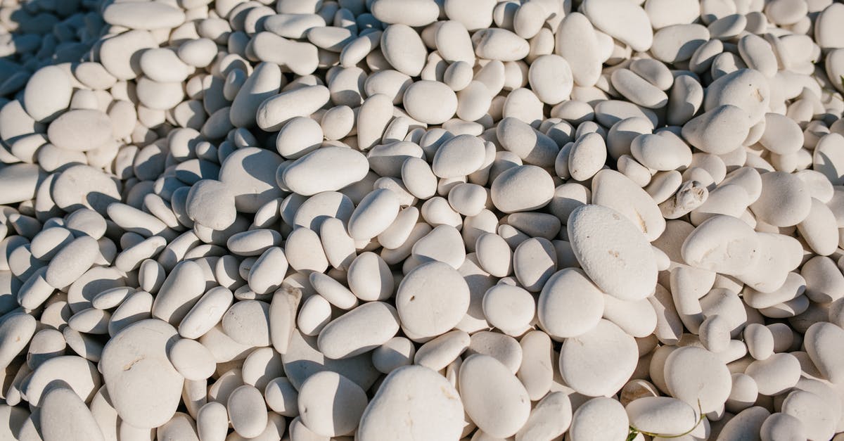 How many Rare Stones does it take to fully upgrade every copy ability? - From above of white small smooth and round stones in pile at sunshine