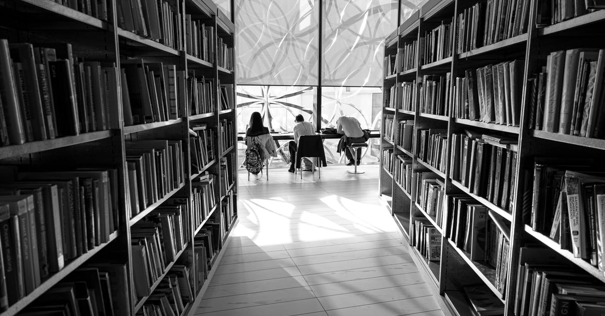 How many Research Quest can the Empire take in Stellais? - Black and white back view of distant anonymous group of visitors studying at table in library with assorted books on bookshelves