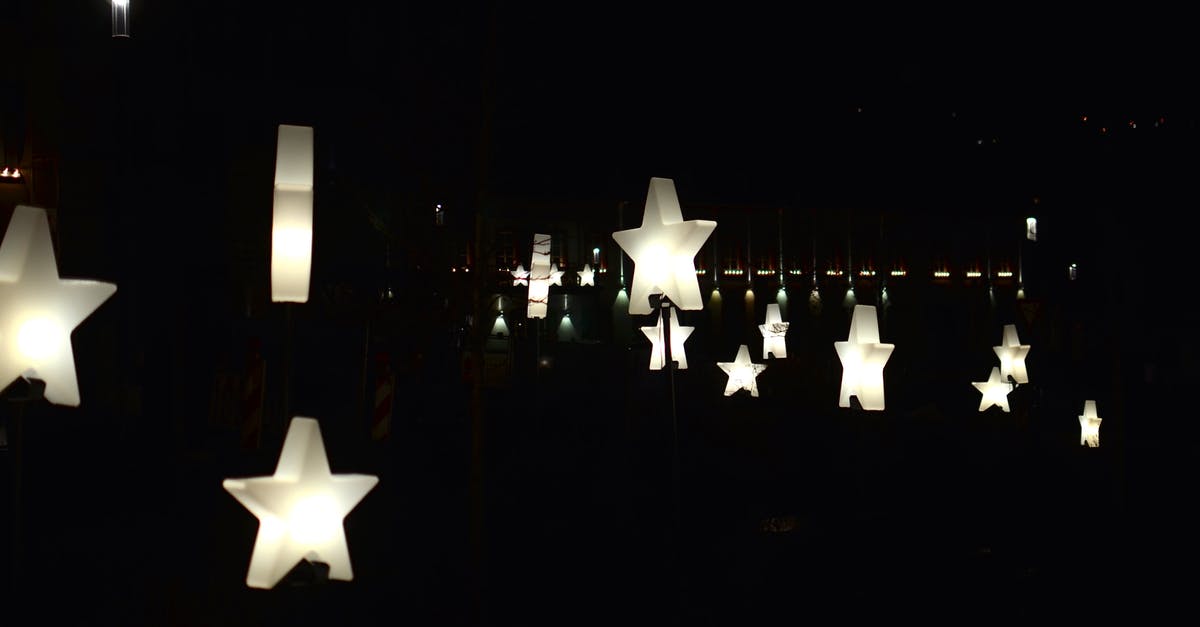 How many stars do you need to get all the badges? - Creative star shaped garlands with glowing lamps decorating street against dark night sky How many stars do you need to get all the badges? - Creative star shaped garlands with glowing lamps decorating street against dark night sky