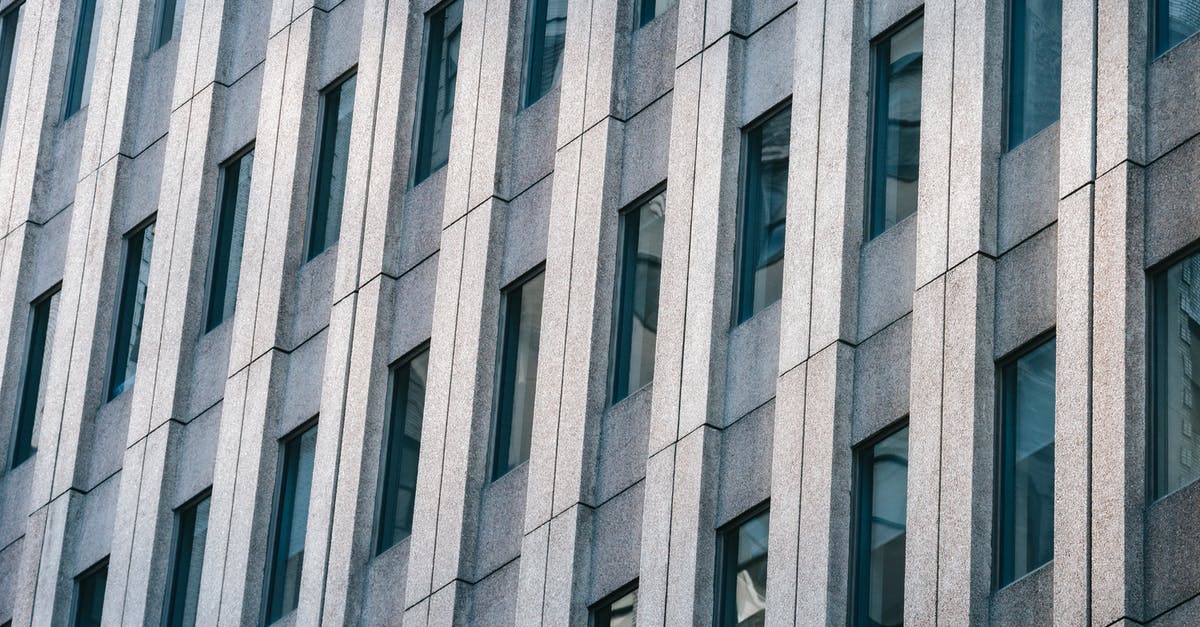 How many stone blocks can you mine with 36 stone pickaxes? - Facade of multistage building with geometric shapes