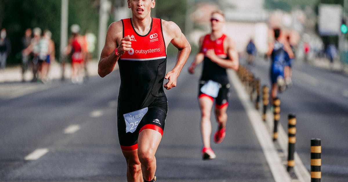How much bonus damage and sign intensity does the Focus talent provide? - Full body of concentrated young man in track suit looking away with mouth opened while running on even asphalt road with arms raised on blurred background