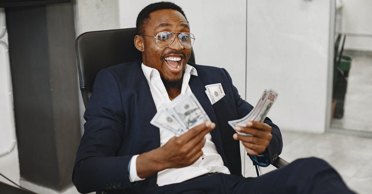 How much currency do you get for a duplicate cosmetic? - Man in Black Suit Jacket Sitting on Black Chair