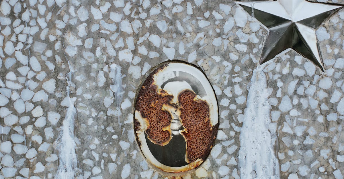 How much damage do Scorchers deal upon death? - Rusty memorial picture on gravestone at cemetery
