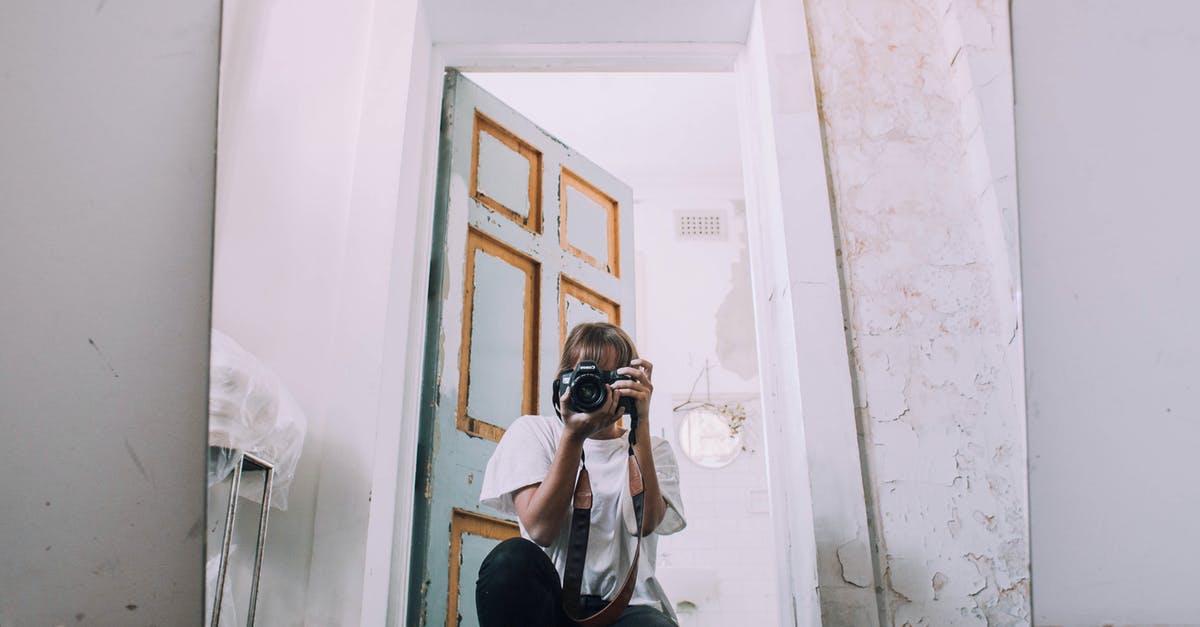 How much damage do you take when failing a hack? - Photographer with photo camera taking selfie in mirror