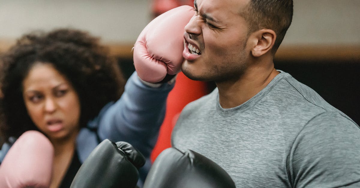How much does Attack Boost increase attack power? - Side view of young muscular ethnic male trainer in sportswear and boxing gloves receiving heavy punch on face from serious young African American female during workout How much does Attack Boost increase attack power? - Side view of young muscular ethnic male trainer in sportswear and boxing gloves receiving heavy punch on face from serious young African American female during workout