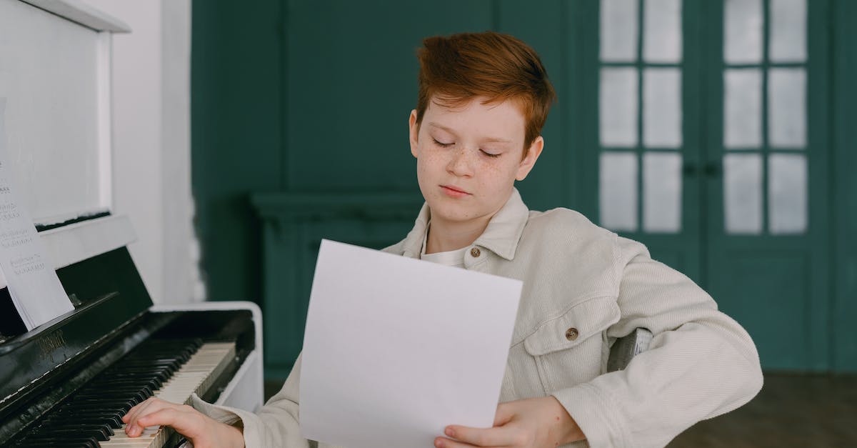 How much faster do Humans learn skills? - Boy with Hand on Piano Keyboard Looking at White Paper