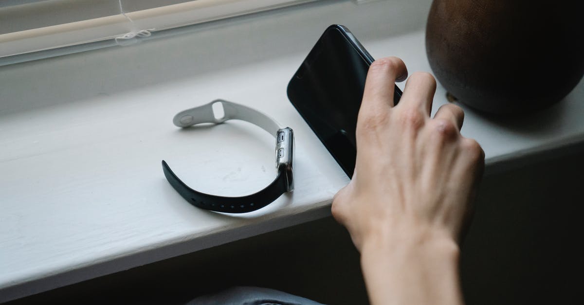 How much influence does it take to level up? - Person with smartphone and wristwatch in bedroom