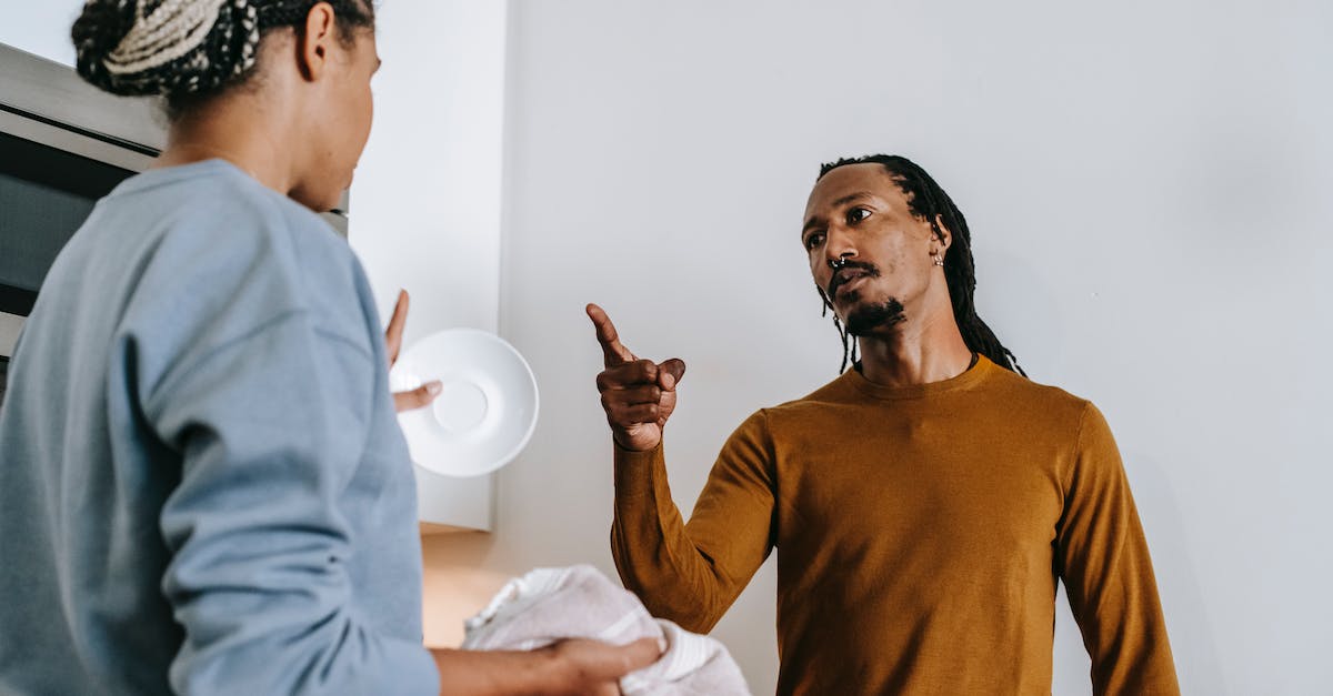 How much is one point of each affix worth for damage? - Annoyed African American male with finger up menacing to anonymous female partner while arguing in kitchen and looking at each other