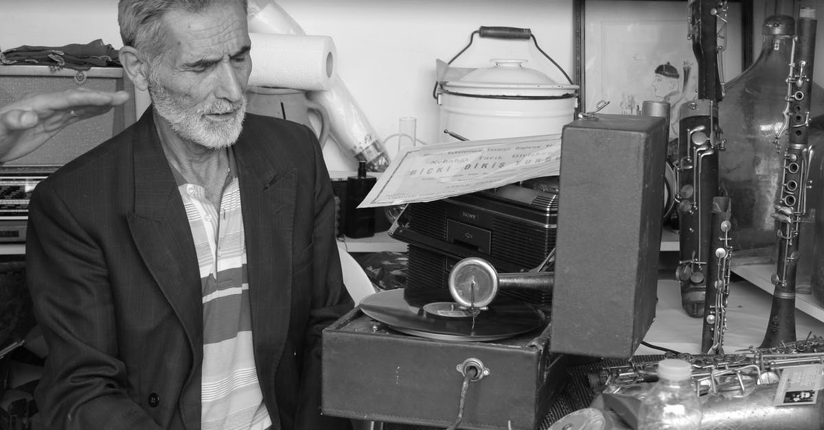 How much money does the radio man require for compensation? - Man in Black Suit Jacket Sitting on Chair How much money does the radio man require for compensation? - Man in Black Suit Jacket Sitting on Chair