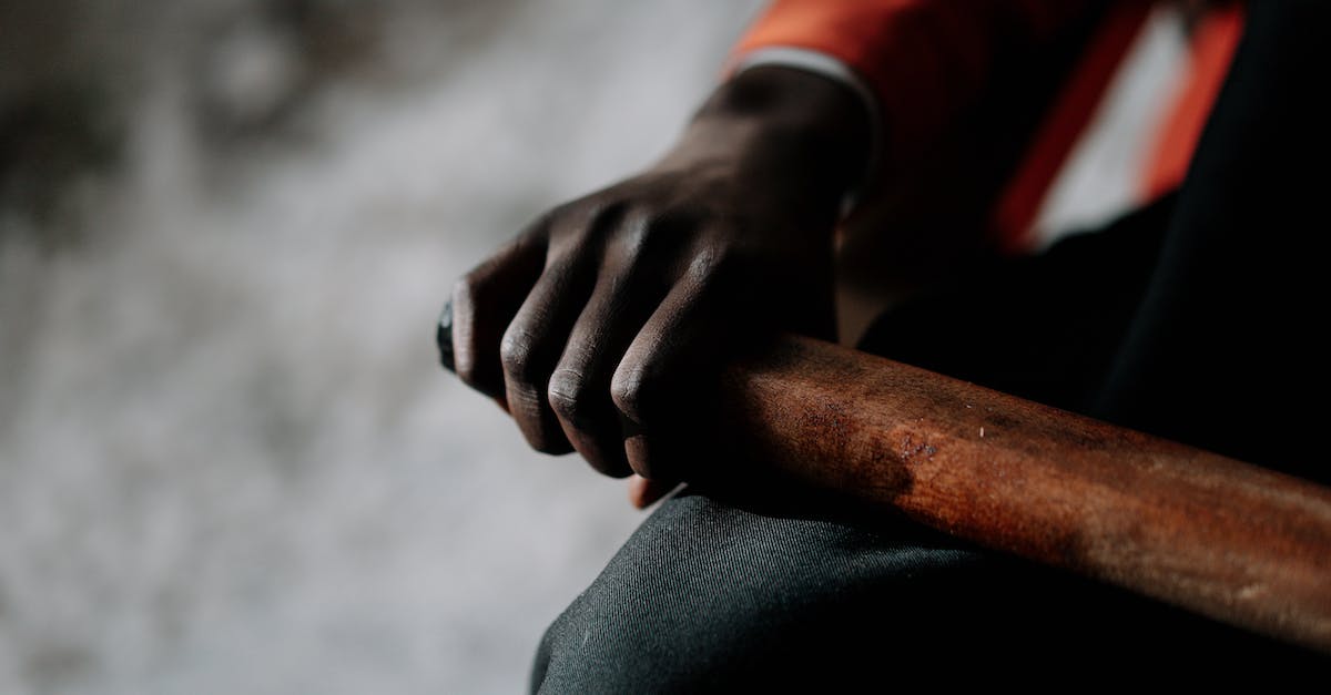 How much strength to wield a 2-handed weapon in 1 hand as barbarian in Diablo 2? - Person in Black Long Sleeve Shirt Holding Brown Wooden Stick