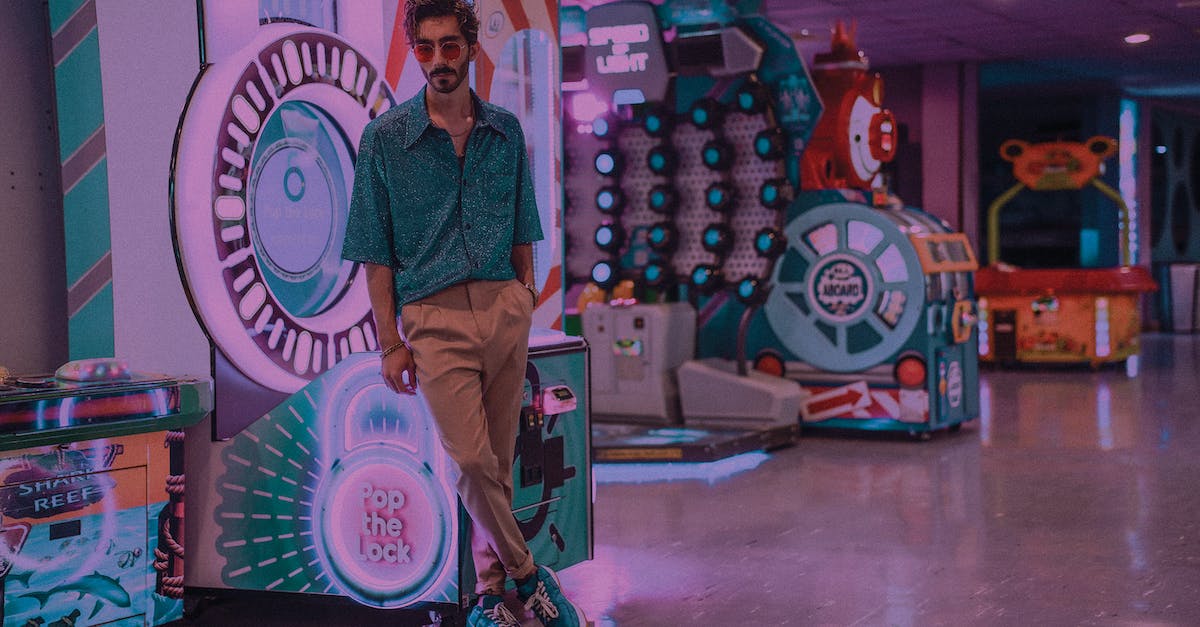 How often do "Something Happened" slot machines appear? - Full body of thoughtful bearded male wearing sunglasses standing with legs crossed and hand in pocket near slot machines in shopping center in city