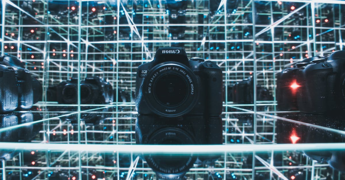How positron cannon works? - Black Canon Camera on Glass Shelf How positron cannon works? - Black Canon Camera on Glass Shelf