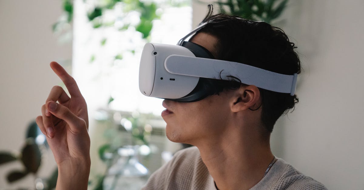 How prevent orbit change while using RCS to point probe anti-radial all time - Side view of concentrated young guy in casual clothes experiencing virtual reality in modern headset at home