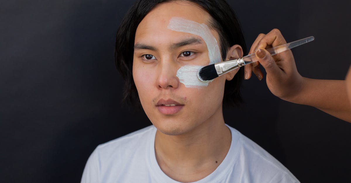 How rare are Foresaken Masters and where do they appear? - Crop beautician applying mask on face of Asian client