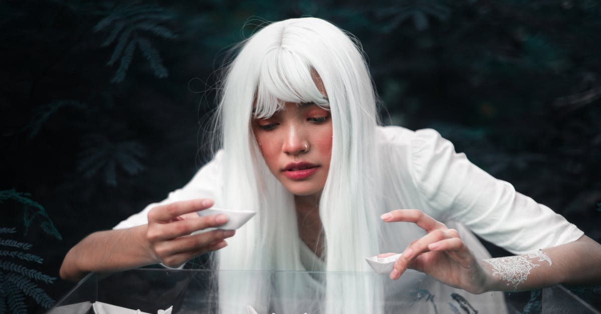 How should I deal with a water nymph in Nethack? - Ethnic lady standing with paper boats in forest