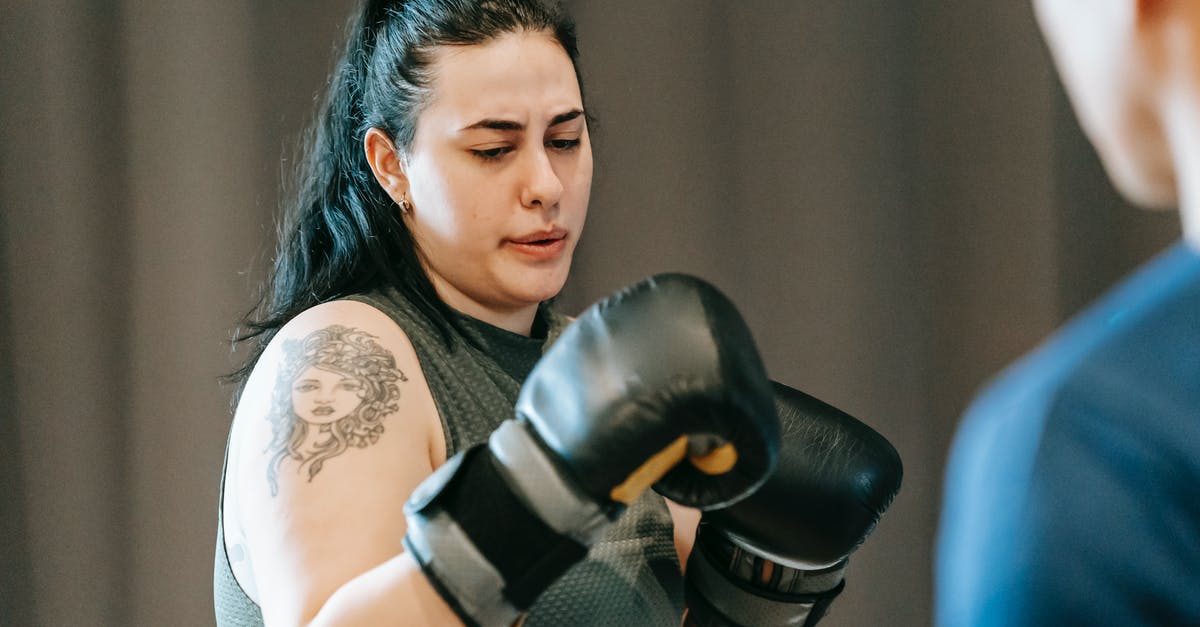 How should I prepare for gym fights? - Female practicing boxing skills with trainer How should I prepare for gym fights? - Female practicing boxing skills with trainer
