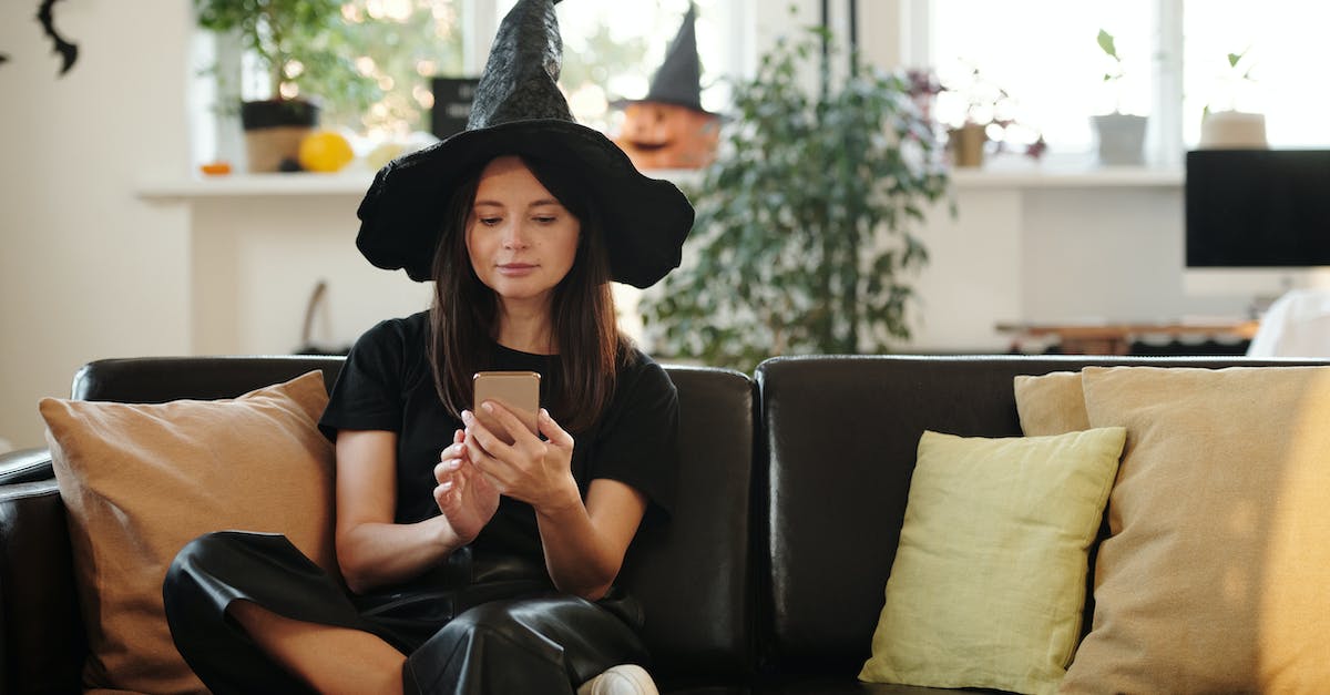 How should the Witch Doctor's Q ability be used? - Woman in Black Shirt and Black Pants Sitting on Black Leather Couch While Using Her Cellphone How should the Witch Doctor's Q ability be used? - Woman in Black Shirt and Black Pants Sitting on Black Leather Couch While Using Her Cellphone