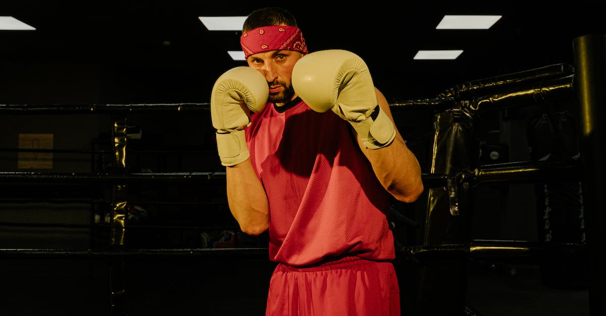 How to attack defending dragons - Serious young male boxer training on ring