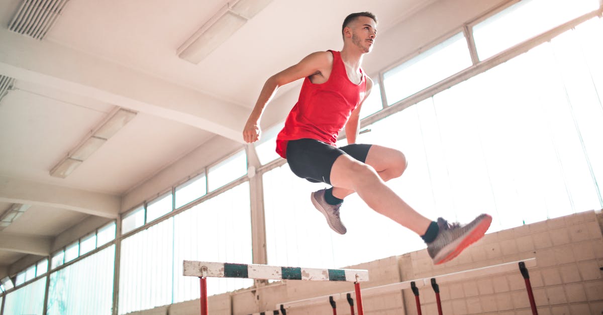 How to benchmark performance before jumping into match - Woman in Red Tank Top Jumping on Obstacle