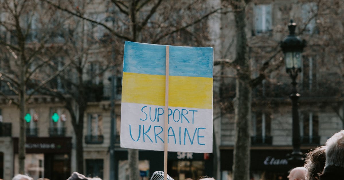 How to best utilize Zz'Rot Portal and banner of command as a support - Large Group of People Holding Banner on Supporting Ukraine