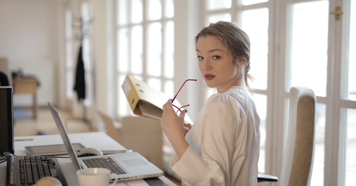 How to breed specialist pops instead of worker pops and how to manage overpopulation on my capital? - Elegant businesswoman with folder in office