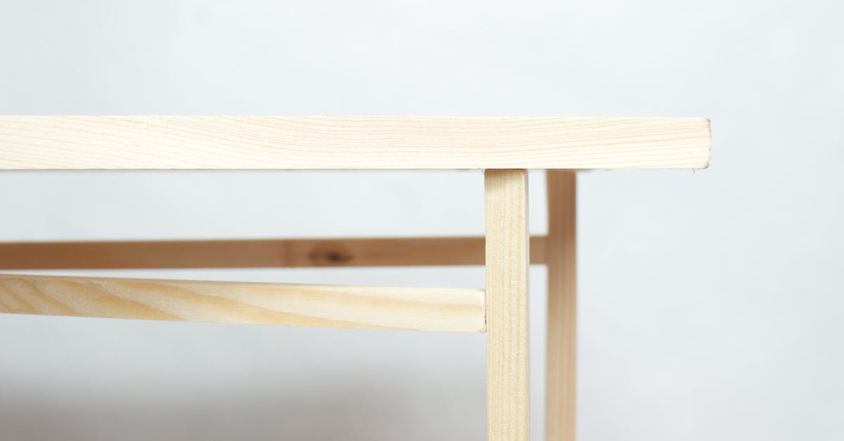 How to build a enchanting table - Wooden piece of furniture with flat top placed in minimal studio against white background