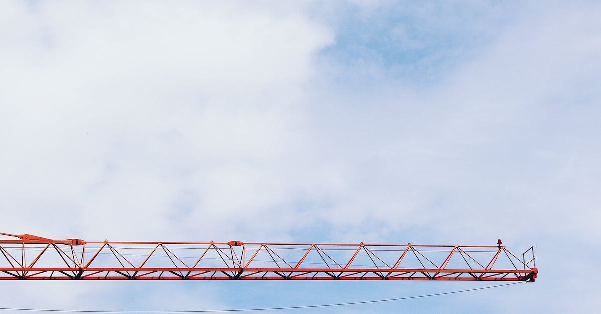 How to build quickly in Red Alert? - Red Crane Photo Under Cloudy Sky during Daytime