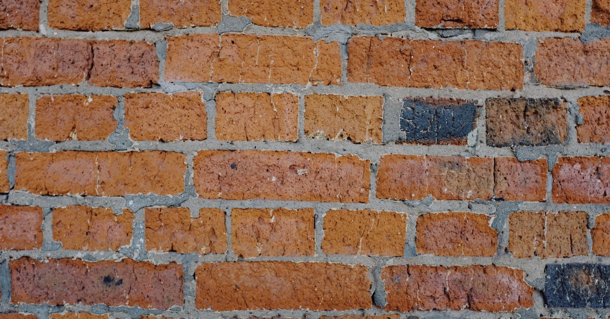 How to build quickly in Red Alert? - Background of abstract old shabby brick wall of building on sunny street in city