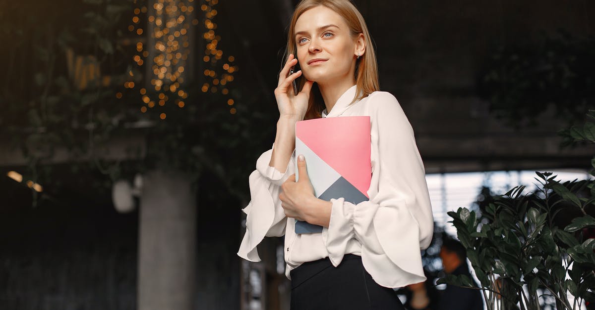 How to call emergency meeting on the Submerged map? - Businesswoman with notebook calling on smartphone in cafe How to call emergency meeting on the Submerged map? - Businesswoman with notebook calling on smartphone in cafe
