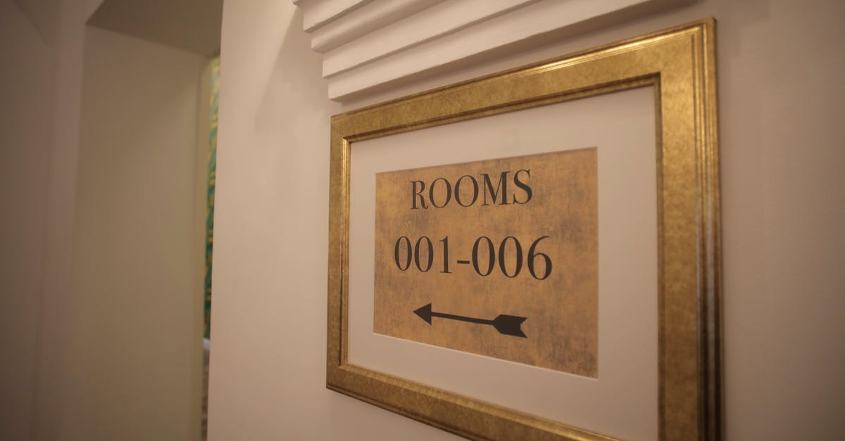 How to cancel Xbox Gold subscription without sign in details? - Sign with rooms numbers hanging on white wall in modern hotel