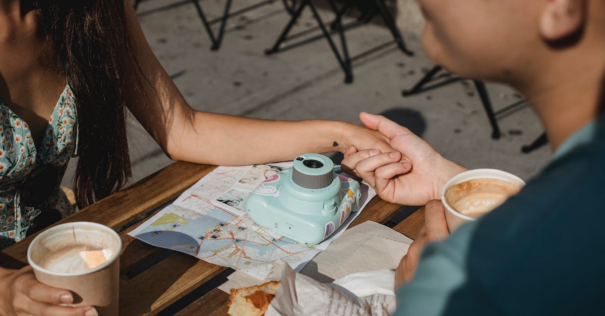 How to change overlay map from toggle to hold? - Couple having coffee in outdoor cafe during trip together How to change overlay map from toggle to hold? - Couple having coffee in outdoor cafe during trip together