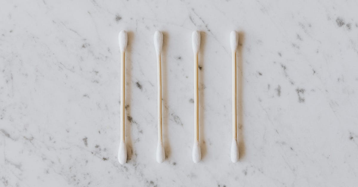 How to clean corrosion from PSP analog stick connector? - Top view of identical cotton swabs on thin wooden sticks with soft rounded edges on marble surface with tiny spots and gray lines How to clean corrosion from PSP analog stick connector? - Top view of identical cotton swabs on thin wooden sticks with soft rounded edges on marble surface with tiny spots and gray lines