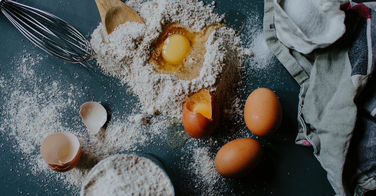 How to /clear a specific spawn egg in from the inventory - From above of broken eggs on flour pile scattered on table near salt sack and kitchenware