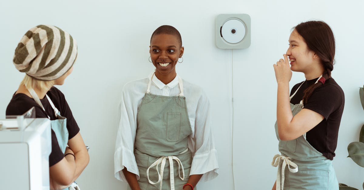 How to complete a new friend quest? - Positive young diverse female baristas in apron uniforms communicating with shy newcomer during break at work How to complete a new friend quest? - Positive young diverse female baristas in apron uniforms communicating with shy newcomer during break at work