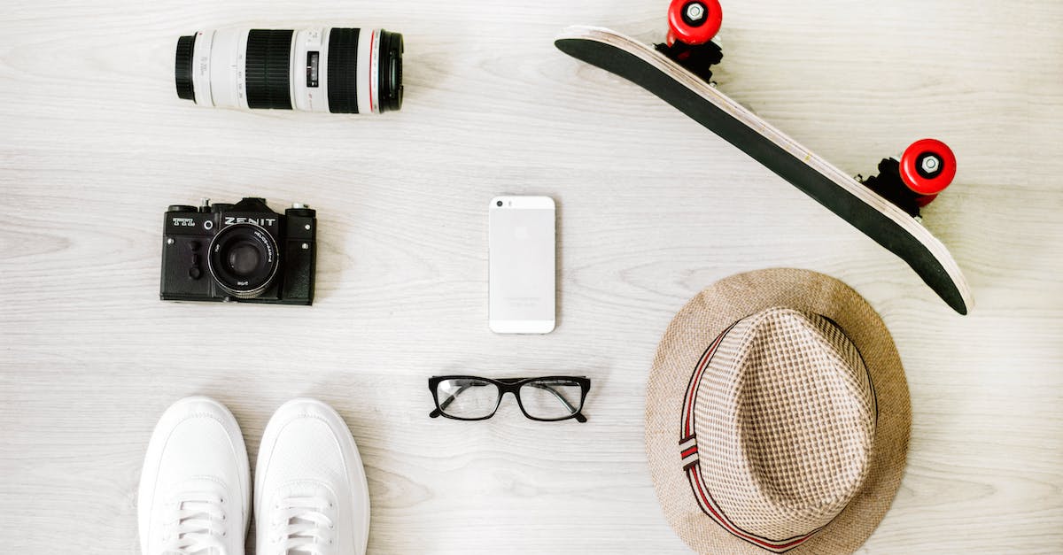How to completely unlock a hat objective? - Photography of Black Skateboard, White Iphone 5, Brown Hat, Black Point-and-shoot Camera, and Zoom Lens