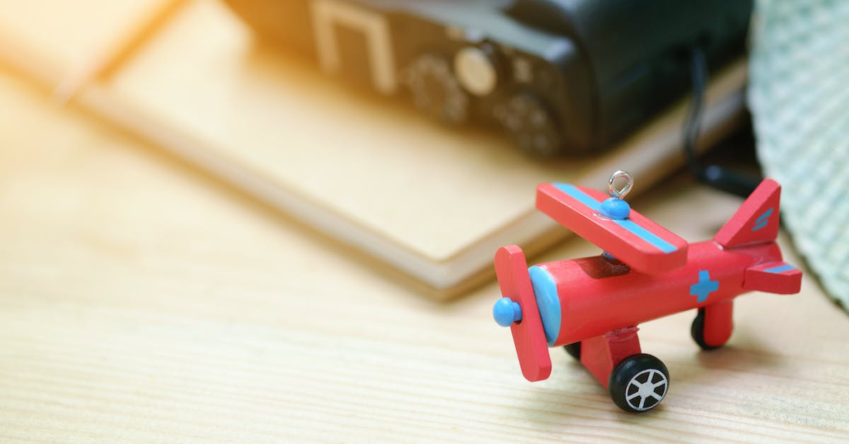 How to completely unlock a hat objective? - Red Biplane Toy on Wooden Surface