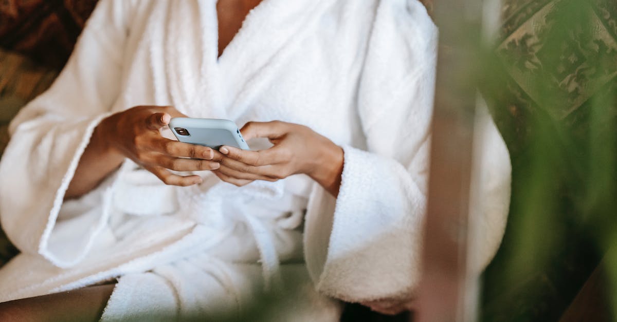 How to configure Media center (Wi-Fi) on the PS4? - Crop anonymous ethnic female text messaging on cellphone while sitting in beauty salon in sunlight