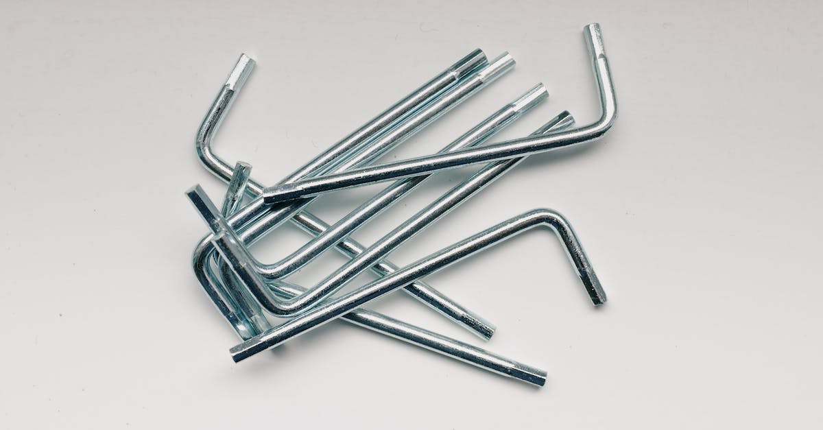 How to configure WinUAE fire keys to work in different ways? (autofire on/off) - From above of different hex keys in heap on white table in workshop