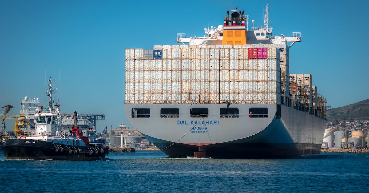 How to controll vessel without crew? - Blue and White Cargo Ship on Sea
