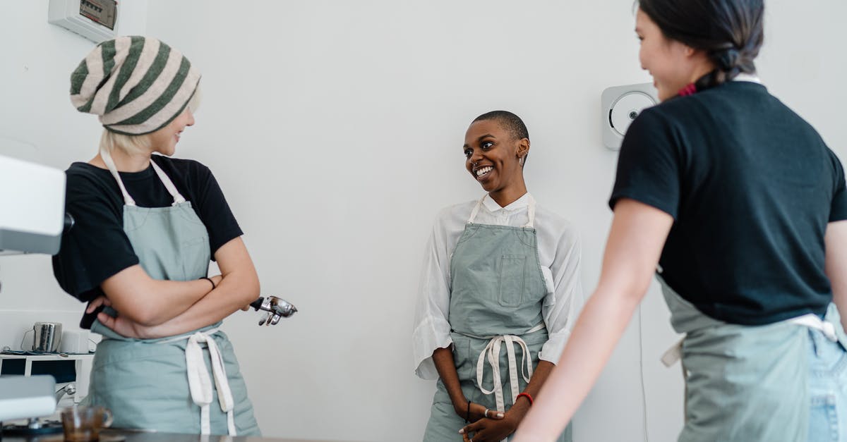 How to counter a team of multiple Torbjörns? - Happy young multiracial female baristas having conversation at workplace