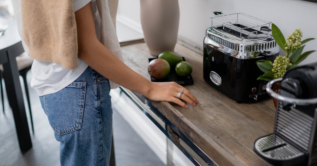How to Counter Ember Spirit and Legion Commander? [closed] - Woman in White T-shirt and Blue Denim Jeans Standing Beside Kitchen Sink