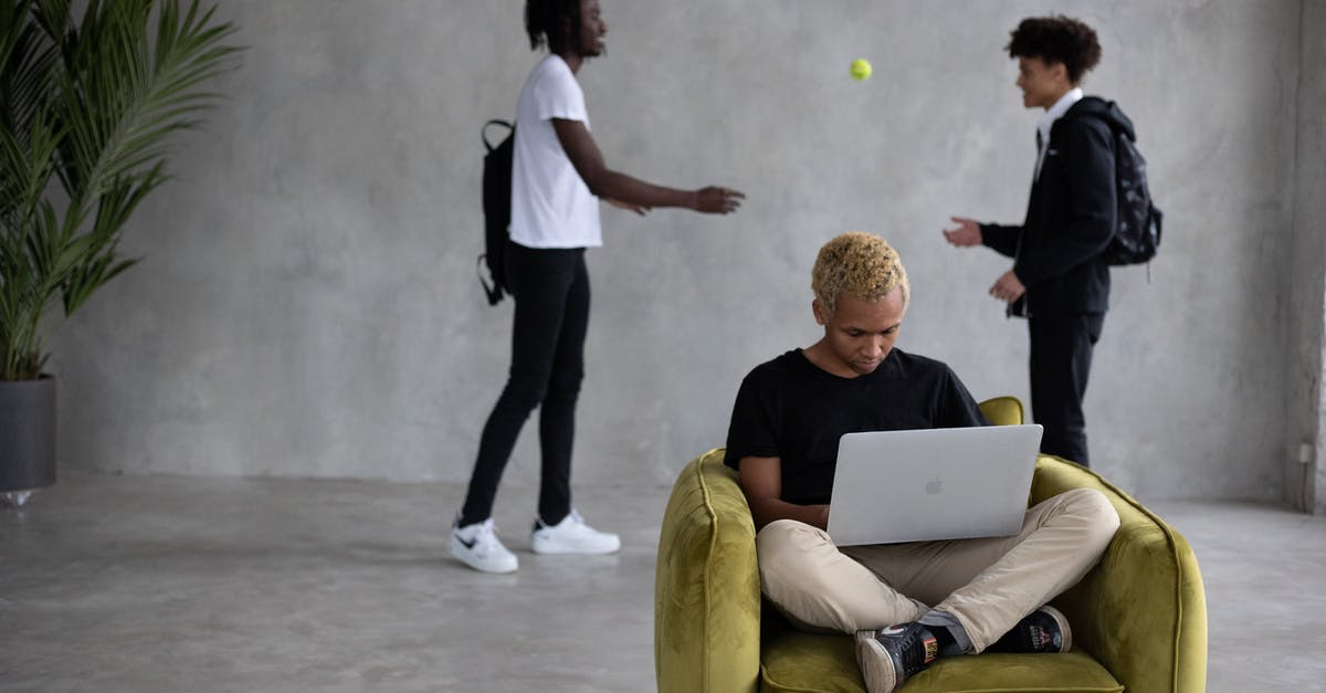 How to cure injured player in Fifa Online 3? - Serious black man using laptop while classmates playing with ball How to cure injured player in Fifa Online 3? - Serious black man using laptop while classmates playing with ball