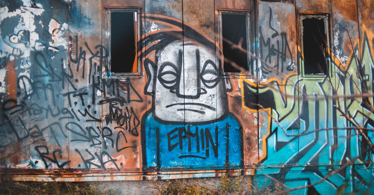 How to destroy barriers for easier snapshot? - Graffiti on wall of shabby building How to destroy barriers for easier snapshot? - Graffiti on wall of shabby building