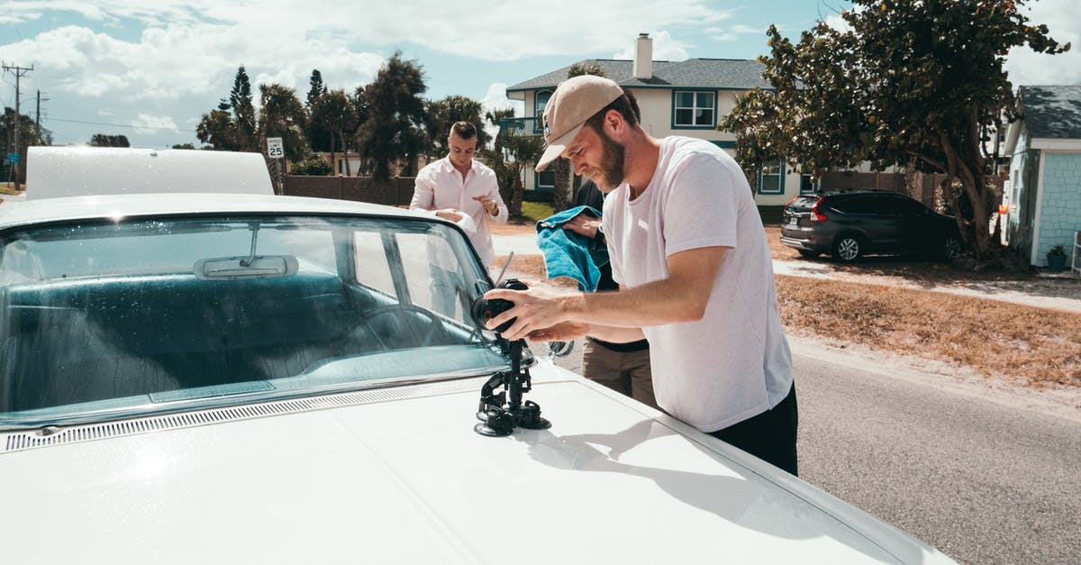 How to detect if a player is wearing a custom set of gear [duplicate] - Man Wears White Crew-neck T-shirt Holding Camera on White Vehicle