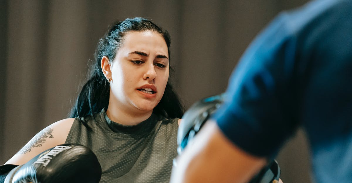How to determine whether Attack or Strength will train faster? - Energetic young female boxer practicing punches with crop anonymous male trainer How to determine whether Attack or Strength will train faster? - Energetic young female boxer practicing punches with crop anonymous male trainer